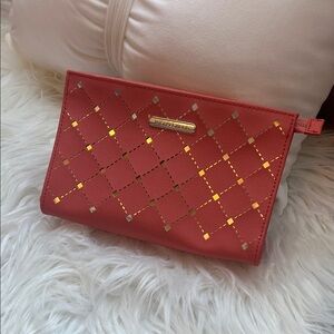 Mystery stuffed MICHAEL KORS Jet Set Travel Saffiano Leather Pouch.